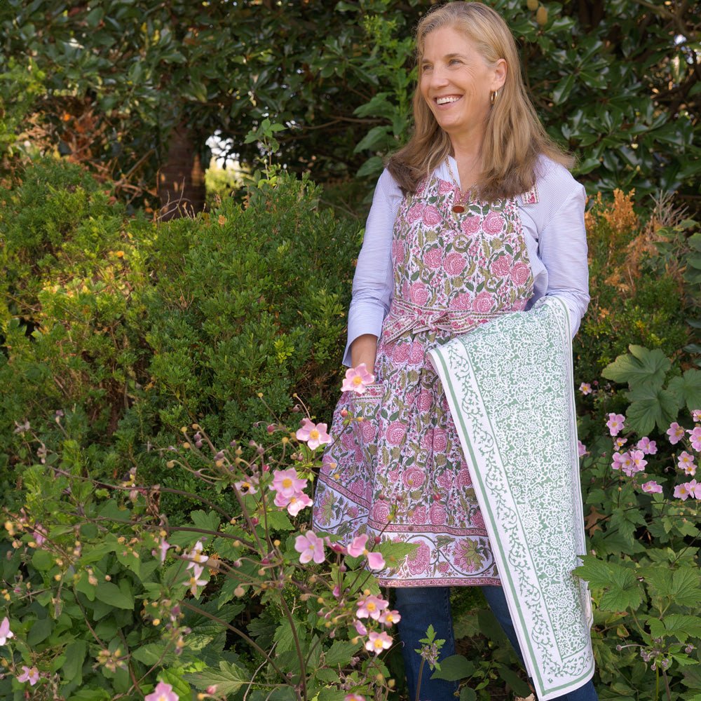 Model wearing Bohemian Floral Moss Green & Mauve Pink apron