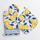 Navy blue and yellow lemon printed pot holder and oven mitt set.