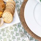 Close up of plate, crackers, and tablecloth.