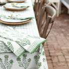 Tea towels on table with matching tablecloth.